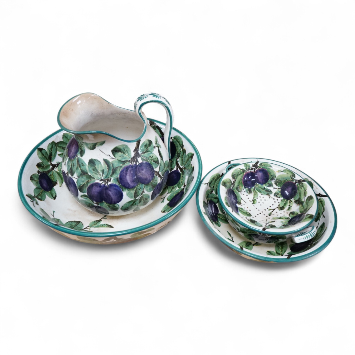 A Wemyss four-piece toilet set, a jug and basin, soap dish with liner, and bowl, damson pattern. Basin 39cm diameter., Condition - poor